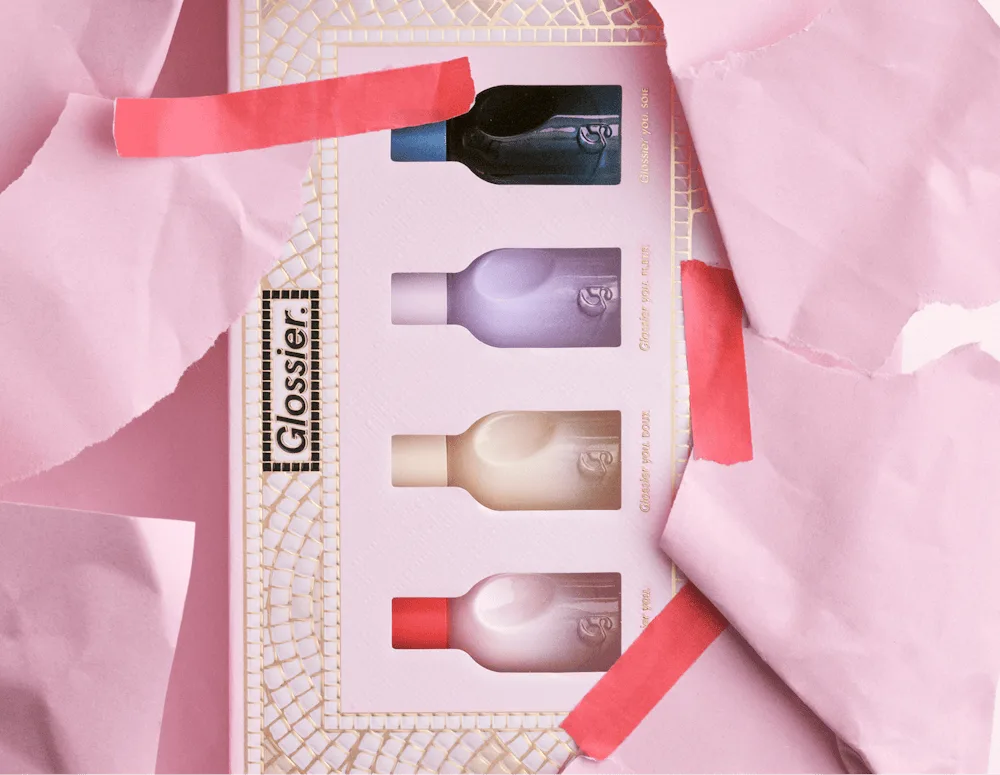 Glossier fragrance wardrobe gift set with pink ribbon
